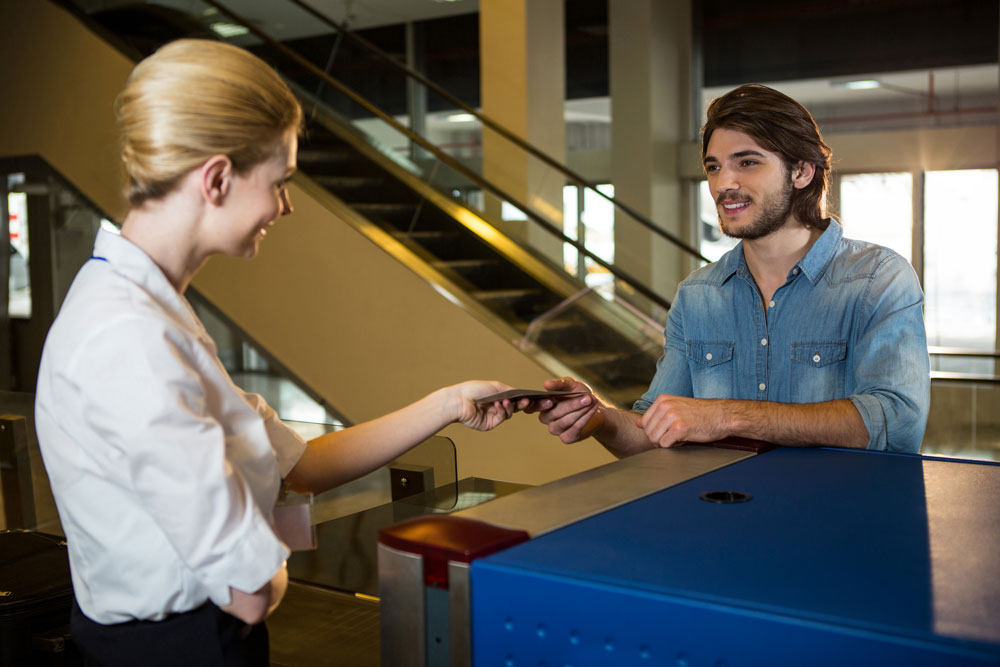 Go first check in. Check in desk attendant. check in desk.